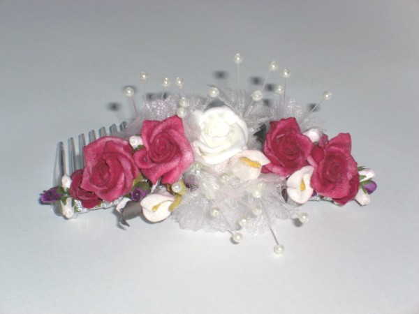 Red and white roses on a strong clear acrylic comb Lovely head piece for a 